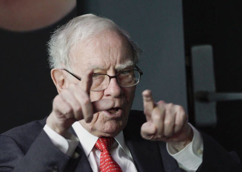 Warren Buffett, chairman and CEO of Berkshire Hathaway, gestures as he plays bridge outside Berkshire-owned Borsheims jewelry store in Omaha, Neb., Sunday, May 6, 2018. On Saturday, tens of thousands of Berkshire Hathaway shareholders attended the annual Berkshire Hathaway shareholders meeting. (AP Photo/Nati Harnik)