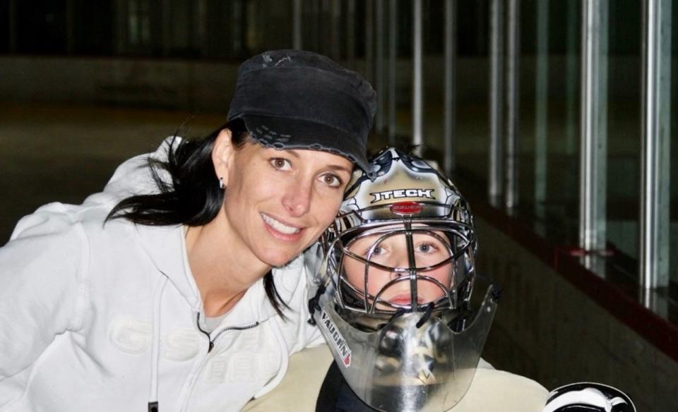 Michigan State goalie Dylan St. Cyr pictured as a young child with his mom, legendary goalie Manon Rheaume.