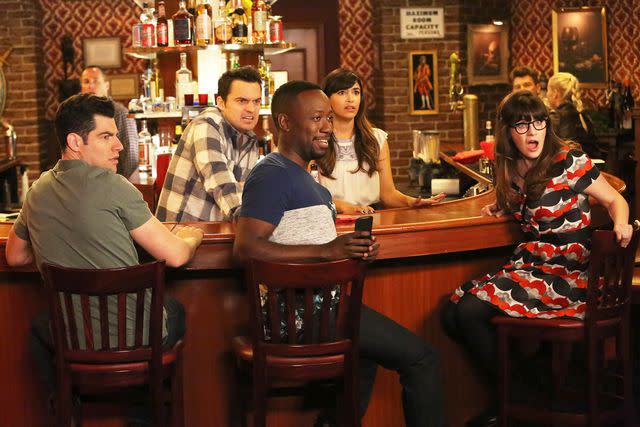 <p>FOX Image Collection/Getty</p> From left: Max Greenfield, Jake Johnson, Lamorne Morris, Hannah Simone, and Zooey Deschanel on 'New Girl'