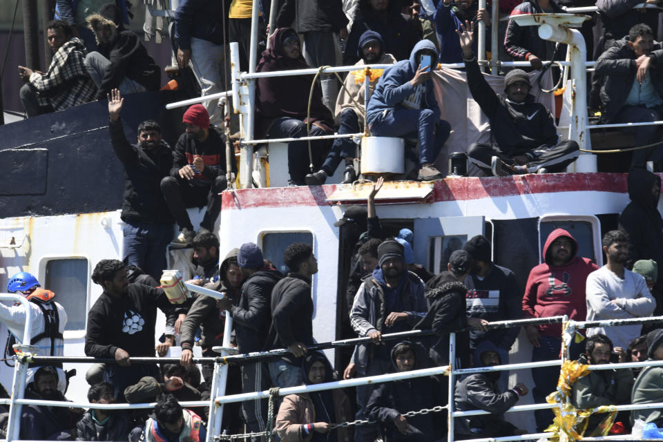 A ship carrying some 700 migrants enters the Sicilian port of Catania on April 12, 2023.  / Credit: Salvatore Cavalli / AP
