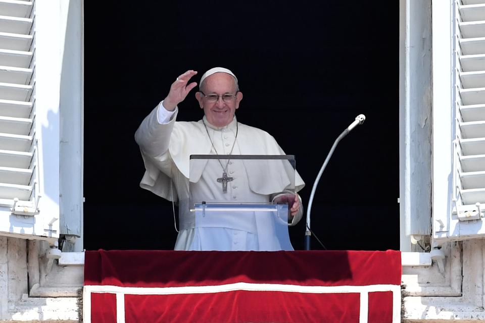 Pope Francis waves to the crowd during the Sunday Angelus prayer at the Vatican on July 15. (Photo: ANDREAS SOLARO via Getty Images)