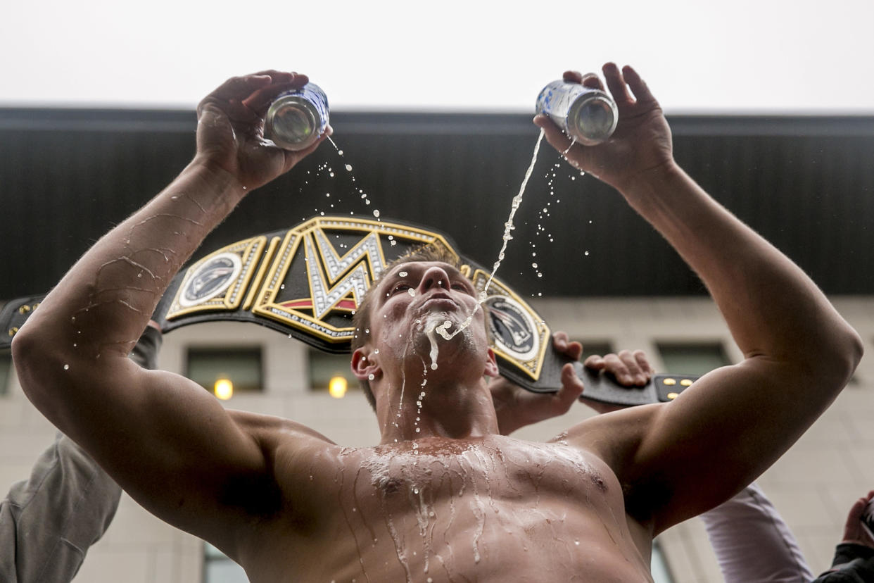 BOSTON, MA - FEBRUARY 07: Rob Gronkowsk of the New England Patriots drinks beers during the Super Bowl victory parade on February 7, 2017 in Boston, Massachusetts. The Patriots defeated the Atlanta Falcons 34-28 in overtime in Super Bowl 51. (Photo by Billie Weiss/Getty Images) *** Local Caption *** Rob Gronkowski