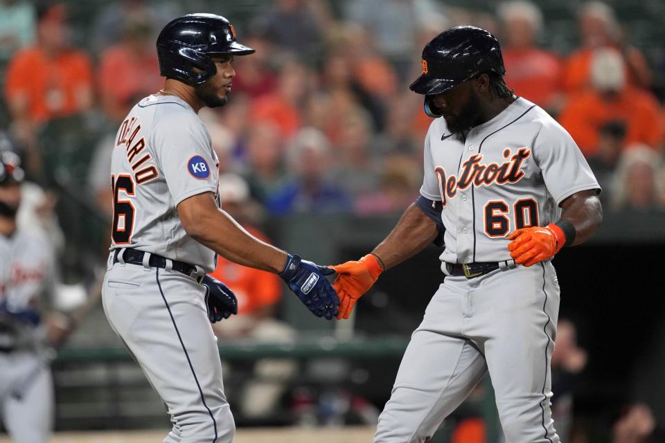 Detroit Tigers  outfielder Akil Baddoo (60) greeted by third baseman Jeimer Candelario after his two-run home run in the third inning against the Baltimore Orioles at Oriole Park at Camden Yards.