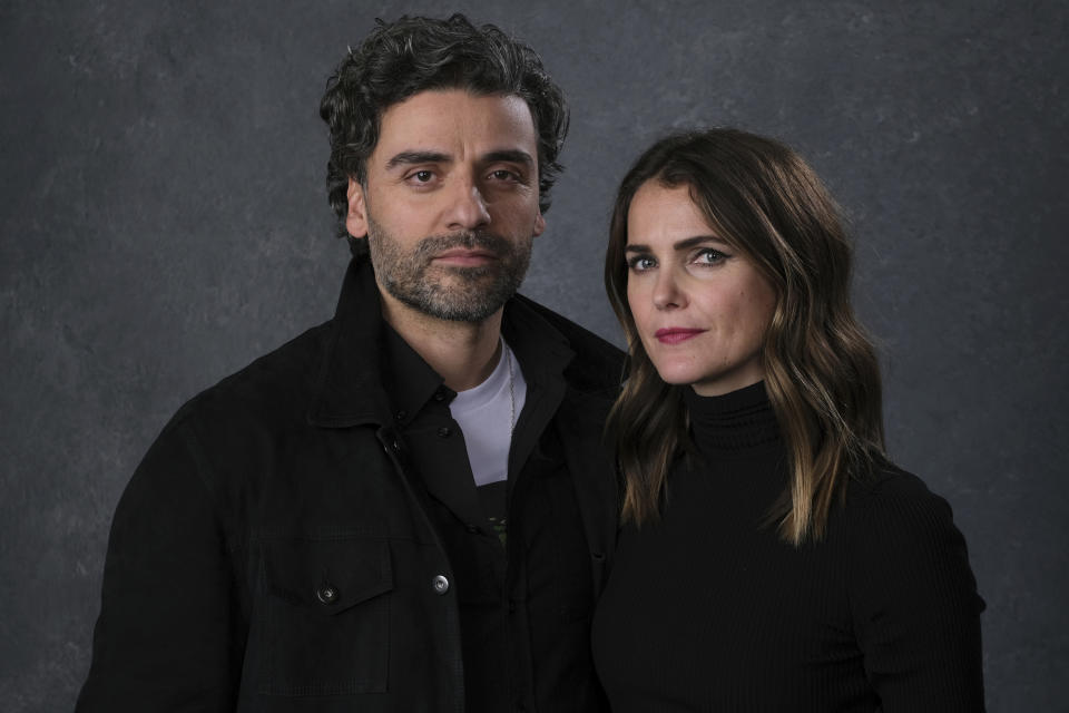 This Dec. 3, 2019 photo shows Keri Russell, right, and Oscar Isaac posing for a portrait to promote their film "Star Wars: The Rise of Skywalker" in Pasadena, Calif. (AP Photo/Chris Pizzello)