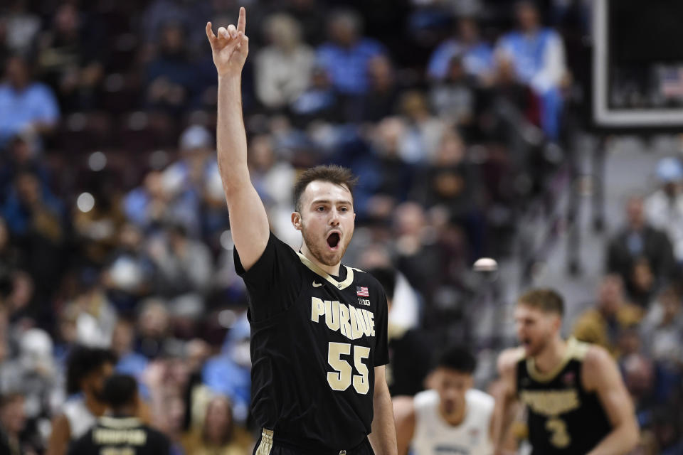 Purdue's Sasha Stefanovic (55) reacts to making a 3-point basket in the first half of an NCAA college basketball game against North Carolina, Saturday, Nov. 20, 2021, in Uncasville, Conn. (AP Photo/Jessica Hill)
