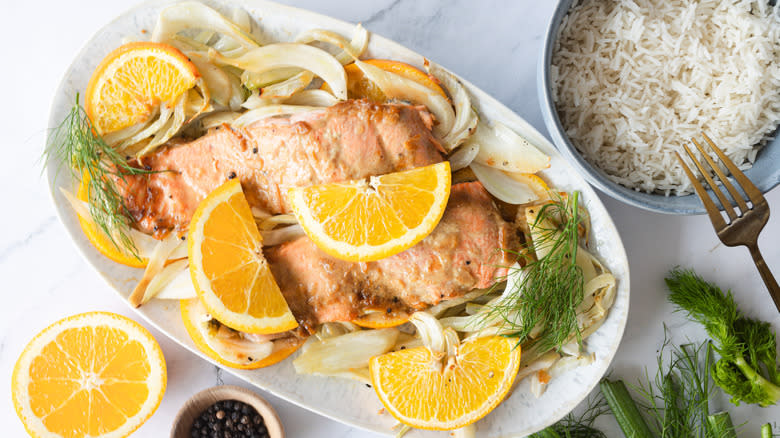 salmon with orange, fennel on platter with rice on the side