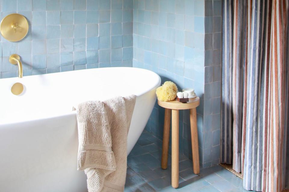 blue bathroom with tub