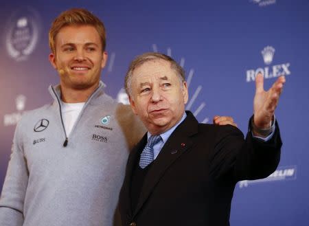 Mercedes' Formula One World Champion Nico Rosberg of Germany poses with Jean Todt, Federation Internationale de l'Automobile (FIA) President during a news conference as Rosberg announces his retirement in Vienna, Austria December 2, 2016. REUTERS/Leonhard Foeger