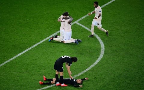 Manchester United's players celebrate after winning the UEFA Champions League round of 16 second-leg football match between Paris Saint-Germain - Credit: AFP