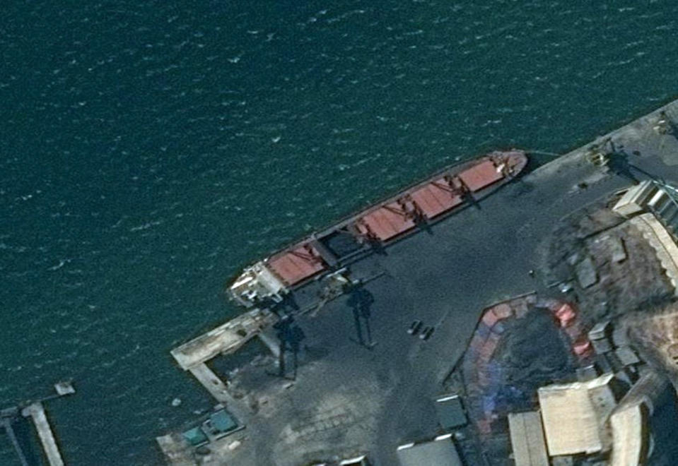 This satellite image provided by the Department of Justice shows what the DoJ says is the North Korean cargo ship Wise Honest docked at a unknown port. The Trump administration has seized the North Korean cargo ship used to supply coal to the isolated nation in violation of international sanctions, law enforcement officials said Thursday, May 9, 2019. The seizure of the vessel, detained last month in Indonesia, comes at a delicate moment between the two countries. (Department of Justice via AP)