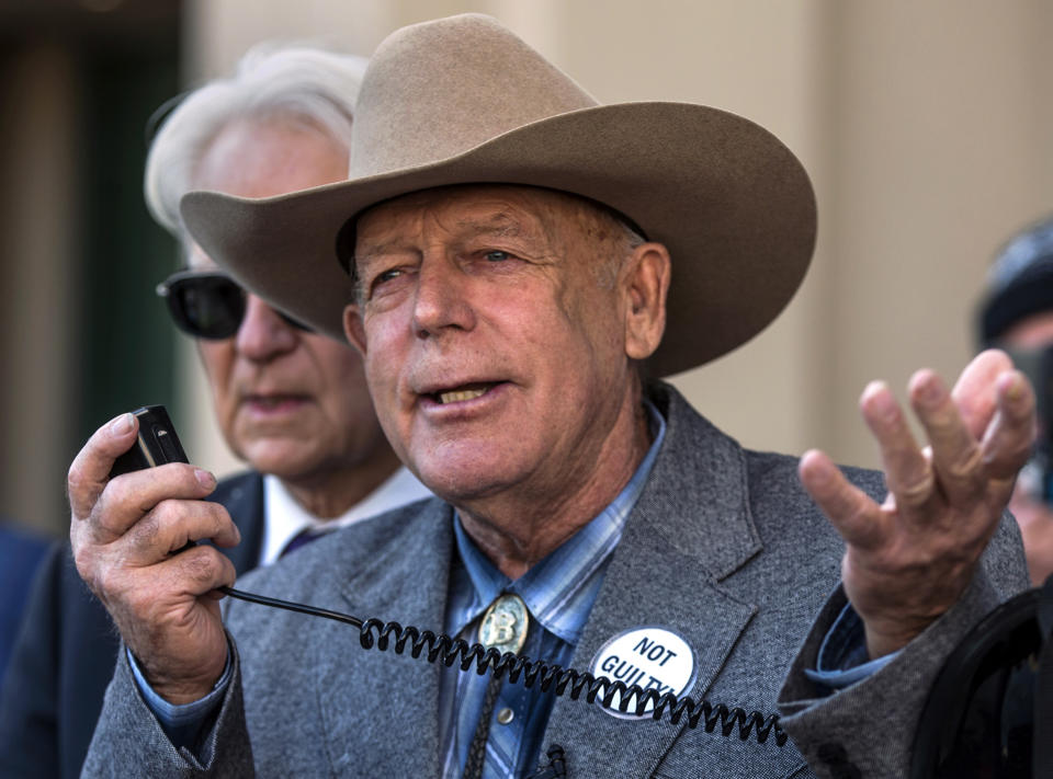 FILE - In this Jan. 10, 2018 file photo, Cliven Bundy talks to reporters outside Las Vegas Metropolitan Police Headquarters in Las Vegas. Brian Cavalier, the former bodyguard for Nevada rancher Bundy, has become the last person sentenced following the collapse of a federal prosecution stemming from an armed standoff with U.S land management agents nearly five years ago. Chief U.S. District Judge Gloria Navarro sentenced Cavalier on Tuesday, Jan. 15, 2019, to the 20 months he already served in custody for the April 2014 confrontation. (L.E. Baskow/Las Vegas Sun via AP, File)