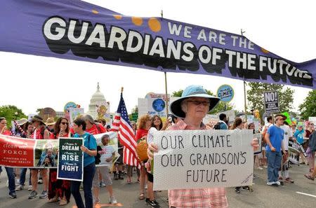 Thousands of demonstrators march down Pennsylvania Avenue during a People's Climate March, to protest U.S. President Donald Trump stance on the environment, in Washington, U.S., April 29, 2017. REUTERS/Mike Theiler