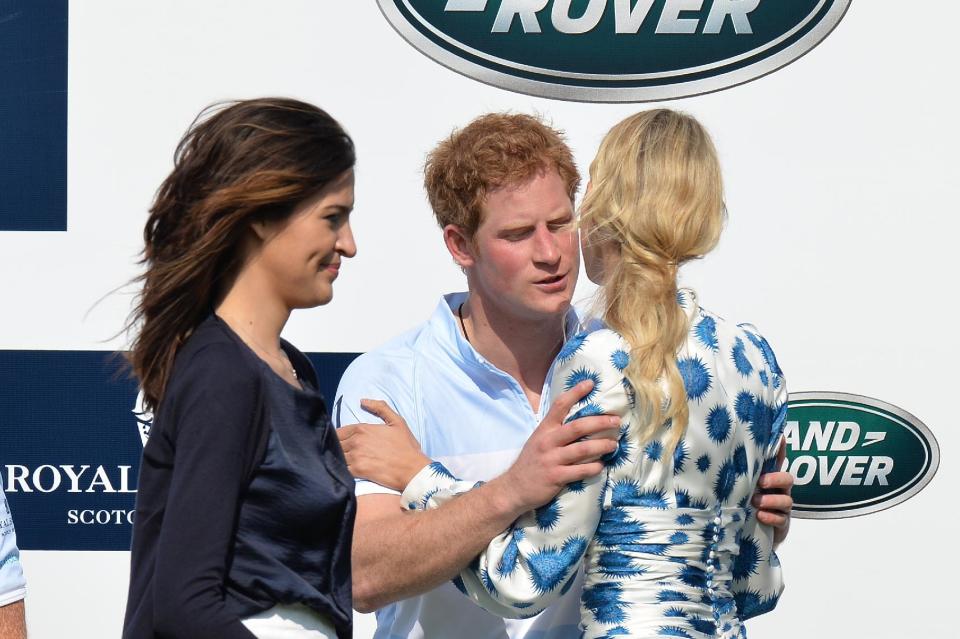 Model Karolina Kurkova congratulates Prince Harry following his teams win in the Sentebale Royal Salute Polo Cup