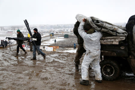 Protesters load equipment onto vehicles as they prepare to evacuate the main opposition camp against the Dakota Access oil pipeline near Cannon Ball, North Dakota, U.S., February 22, 2017. REUTERS/Terray Sylvester