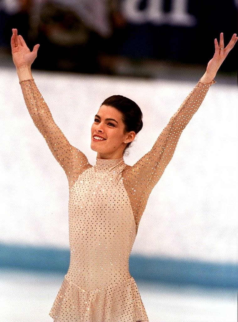 nancy raises her hands in celebration