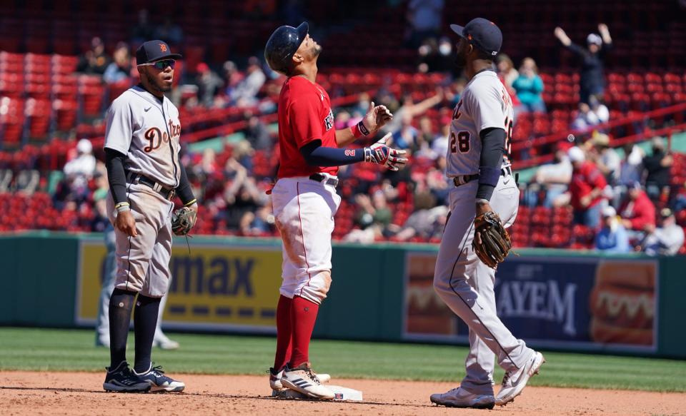 Boston Red Sox shortstop Xander Bogaerts (2) hits a double to drive in a run against the Detroit Tigers in the fourth inning May 6, 2021, at Fenway Park.