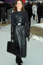 <b>Couture Fashion Week:</b> Noomi Rapace worked a wet-look black trench and fluffy bag ©Rex
