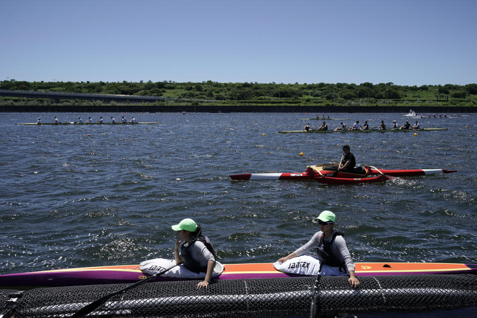 Athletes prepare for a test run at the Sea Forest Waterway, a venue for rowing at the Tokyo 2020 Olympics, Sunday, June 16, 2019, in Tokyo. (AP Photo/Jae C. Hong)