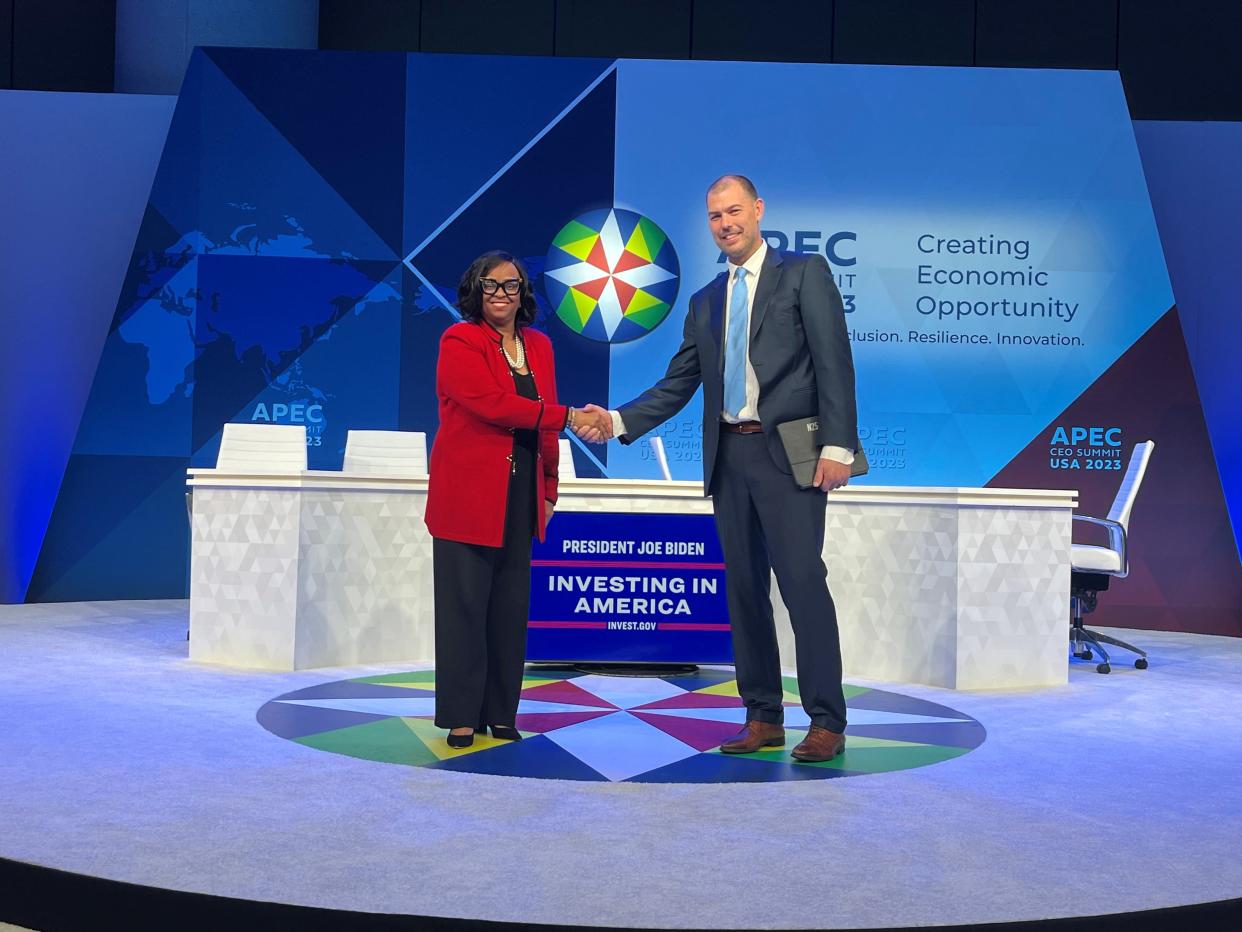 Kyle Clark, founder and chief executive officer of Beta Technologies, shakes hands with Reta Jo Lewis, president and chair of the Export-Import Bank of the United States at an event in Washington, D.C., where the bank announced a $169 million loan to Beta.