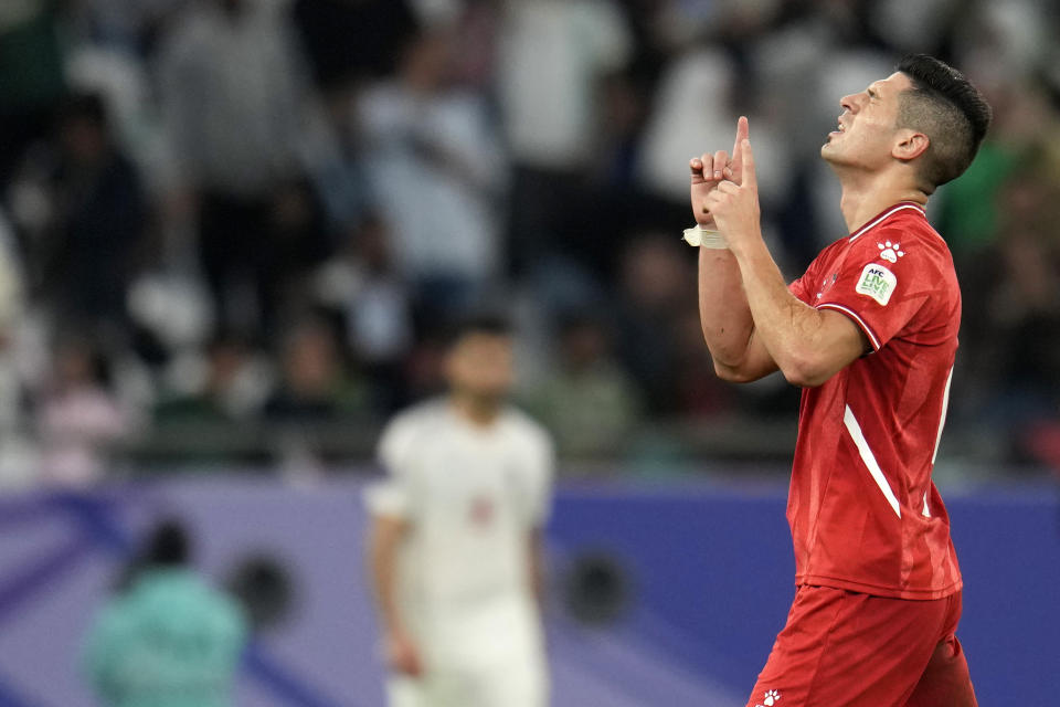 Palestine's Tamer Seyam reacts after scoring his side's first goal during the Asian Cup Group C soccer match between Iran and Palestine at the Education City Stadium in Al Rayyan, Qatar, Sunday, Jan. 14, 2024. (AP Photo/Aijaz Rahi)