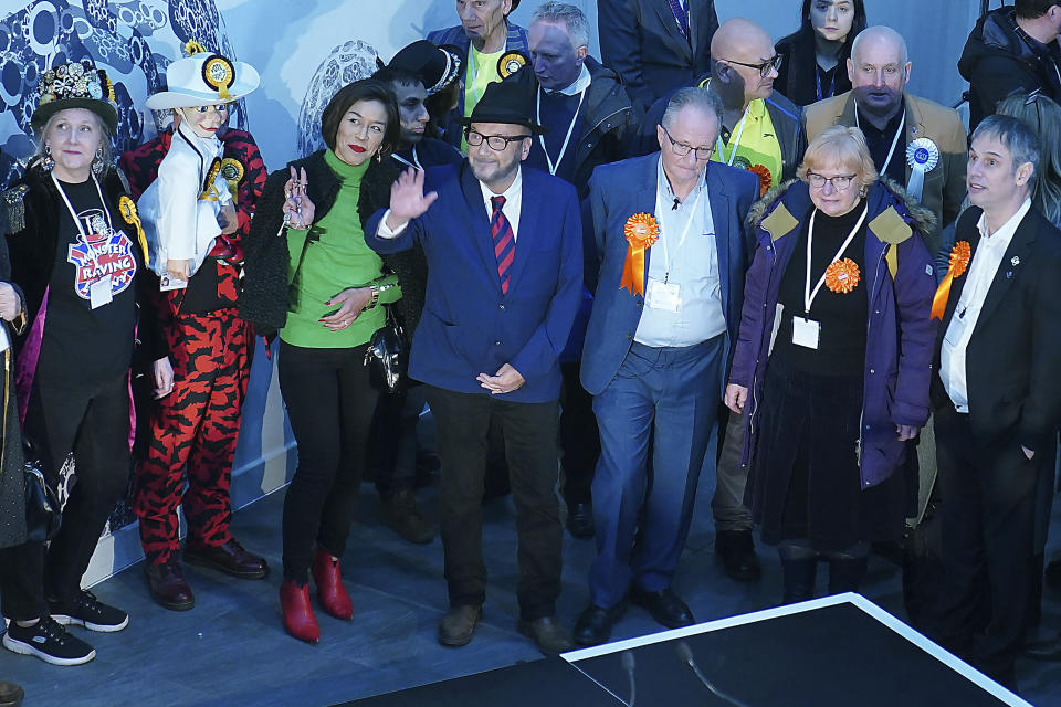 George Galloway, front center, waves after being declared winner in the Rochdale by-election, which was triggered after the death of Labour MP Sir Tony Lloyd, in the town of Rochdale, England Thursday, Feb. 29, 2024. (Peter Byrne/PA via AP)