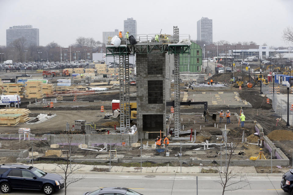 FILE - Construction continues on Orleans Landing, a housing development along the Detroit riverfront, Dec. 8, 2015. The city was insolvent in July 2013 when then-state appointed emergency manager Kevyn Orr filed for Detroit's historic bankruptcy. A decade later, the Motor City has risen from the ashes of insolvency, with balanced budgets, revenue increases and millions of dollars socked away. (AP Photo/Carlos Osorio, File)