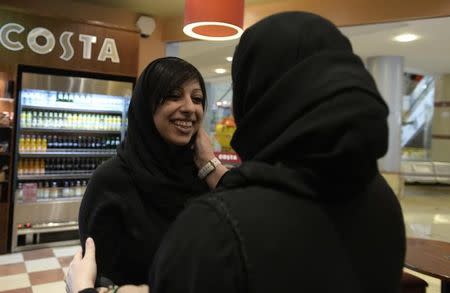 Bahraini activist Zainab al-Khawaja (L) is greeted by Sumaiya Rajab, wife of jailed activist Nabeel Rajab, after her release from prison in Budaiya, west of Manama, February 16, 2014. REUTERS/Stringer