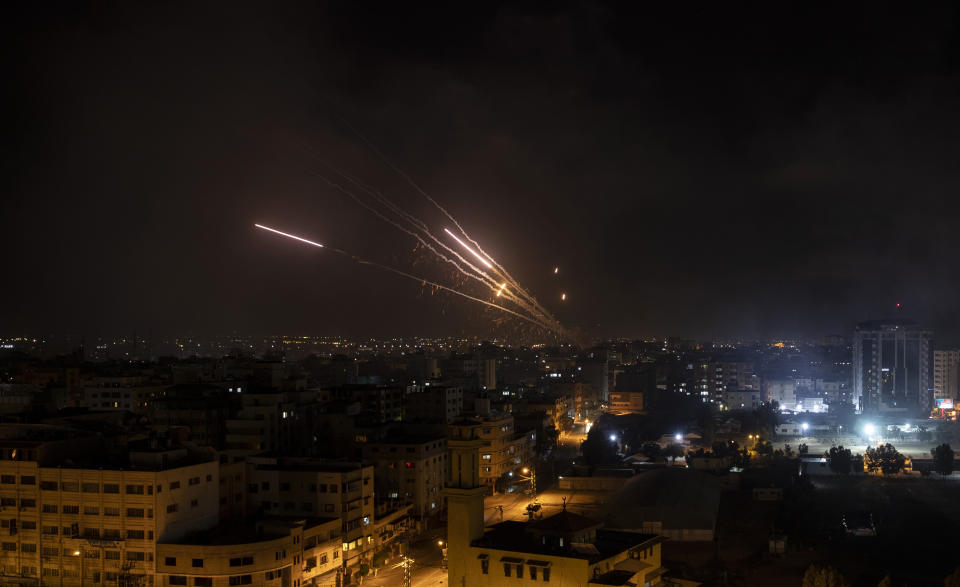 Rockets are launched from the Gaza Strip towards Israel, Wednesday, May 12, 2021. (AP Photo/Khalil Hamra)