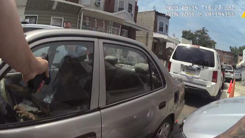 Footage from Officer Mark Dial's body camera shows him pointing a gun at Eddie Irizarry as he sits in his car. / Credit: Philadelphia District Attorney's Office