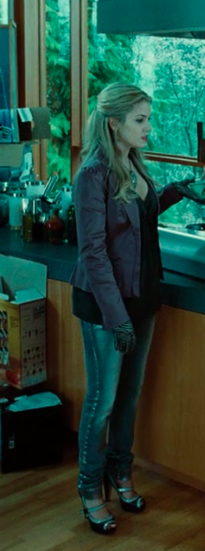 Rosalie wearing heels, jeans, a shirt, jacket, gloves, and a necklace