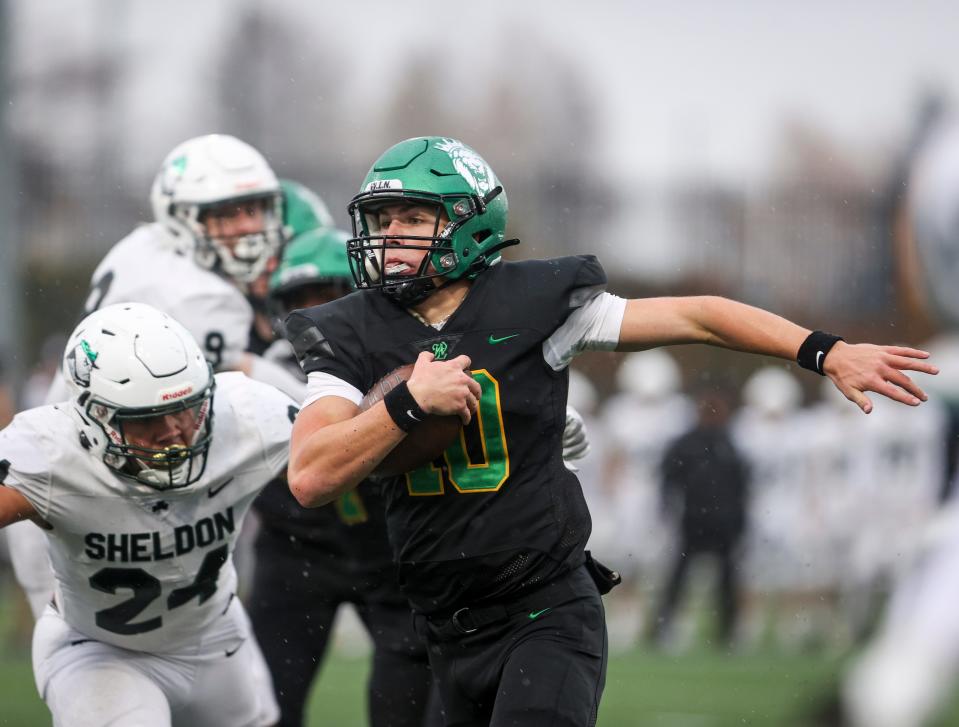 West Linn's Sam Leavitt (10) runs the ball during the 6A OSAA state championship game against Sheldon on Friday, Nov. 25, 2022 at Hillsboro Stadium in Hillsboro, Ore.