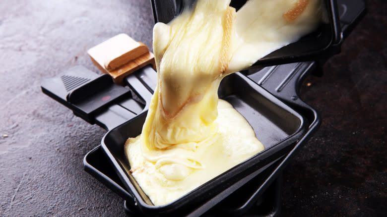 Cheese poured from raclette dish