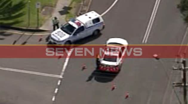 Police officers cordon off the streets outside St Mary's Star of the Sea College at Wollongong. Photo: FIRST ON 7NEWS