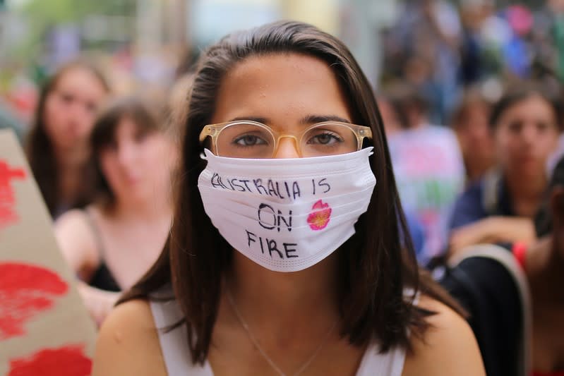 A student activist poses for a portrait during a 'Solidarity Sit-down' outside of the office of the Liberal Party of Australia in Sydney