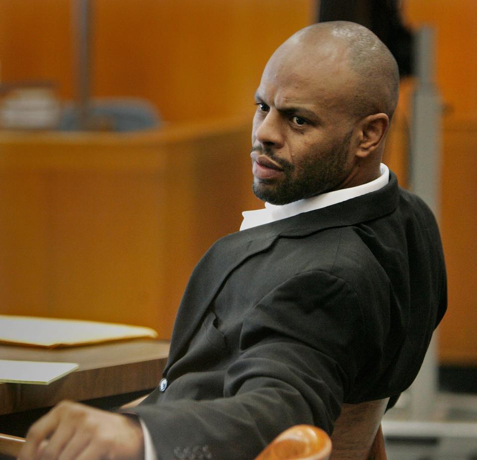 Michael McGee looks to friends and spectators in the courtroom before Judge Dennis Moroney, Monday, May 19, 2008.