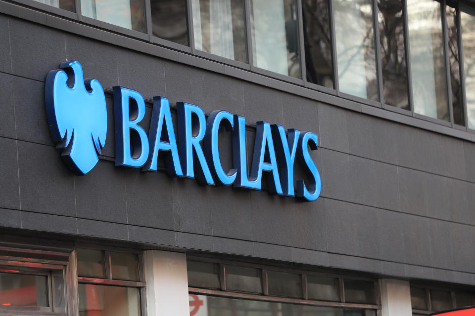 A view of a sign for a Barclays bank in London.