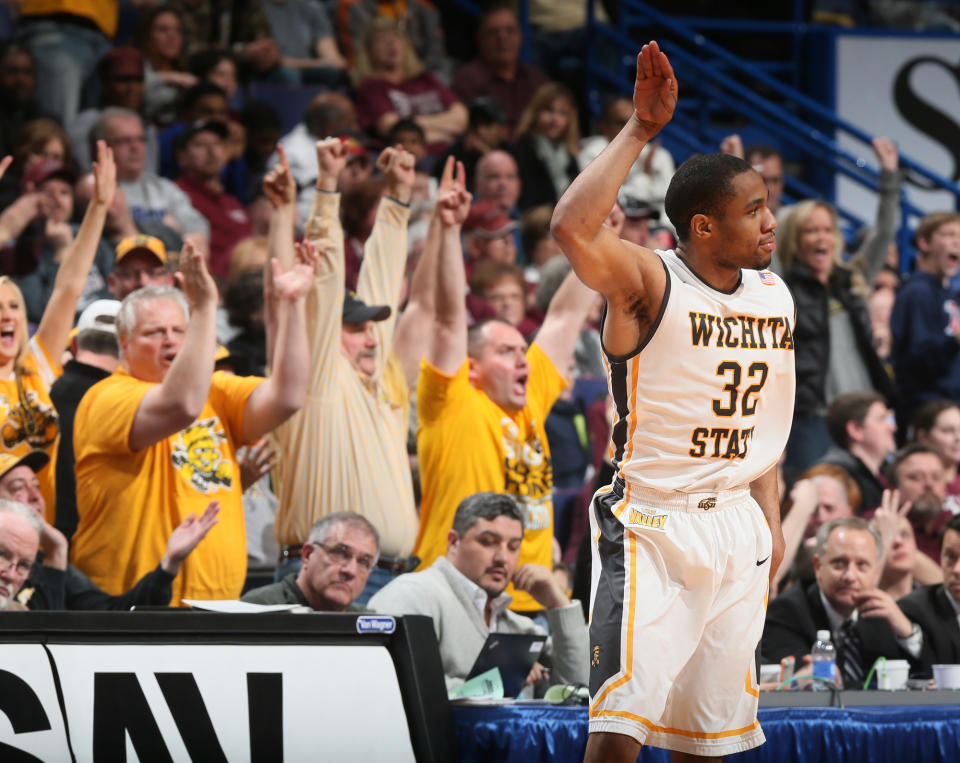 Wichita State guard Tekele Cotton reacts after hitting a three-point shot in second half action during the Missouri Valley Conference tournament championship game between Wichita State and Indiana State on Sunday, March 9, 2014, at the Scottrade Center in St. Louis. (AP Photo/St. Louis Post-Dispatch, Chris Lee) EDWARDSVILLE INTELLIGENCER OUT; THE ALTON TELEGRAPH OUT