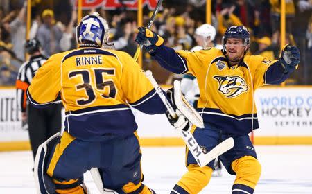 FILE PHOTO: May 9, 2016; Nashville, TN, USA; Nashville Predators goalie Pekka Rinne (35) celebrates with defenseman Roman Josi (59) after defeating the San Jose Sharks during the overtime period in game six of the second round of the 2016 Stanley Cup Playoffs at Bridgestone Arena. The Predators won 4-3. Mandatory Credit: Aaron Doster-USA TODAY Sports / Reuters Picture Supplied by Action Images (TAGS: Sport Ice Hockey NHL) *** Local Caption *** 2016-05-10T041220Z_1416209144_NOCID_RTRMADP_3_NHL-STANLEY-CUP-PLAYOFFS-SAN-JOSE-SHARKS-AT-NASHVILLE-PREDATORS.JPG