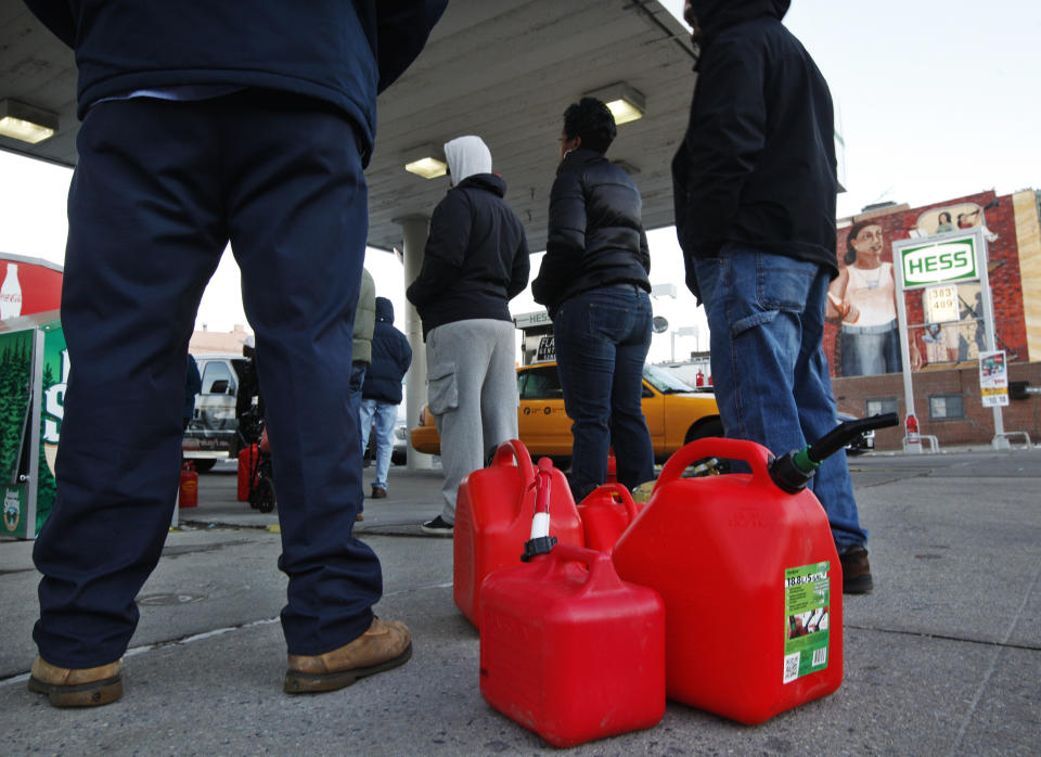 Customers wait in line for gas at a Hess fuelling station in Brooklyn, New York, November 9, 2012. Superstorm Sandy left a trail of destruction and despair in the U.S. Northeast, but it also exposed a surprising fault line in the ability of gasoline stations to keep fuel flowing. (REUTERS/Brendan McDermid)