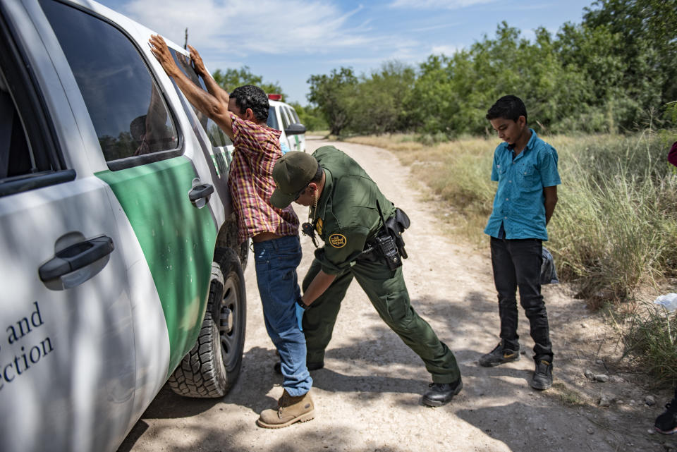 Border Patrol agent Roy Ramirez searches an illegal immigrant