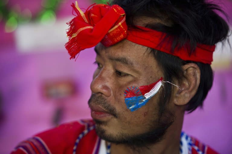 This photo taken on January 10, 2016 shows a man from the ethnic minority Karen, who have their own calendar and have officially celebrated their New Year since the 1930s, attending celebrations to mark their New Year festival in Yangon