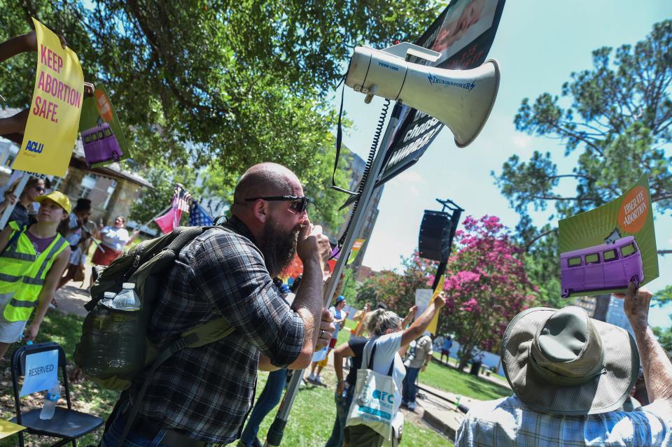 Anti-Abortion protestor Alan Siders of Ridgeland, Miss., counters those rallying for abortion at the D-Day rally in Smith Park, Jackson, Miss., Friday, June 17, 2022.