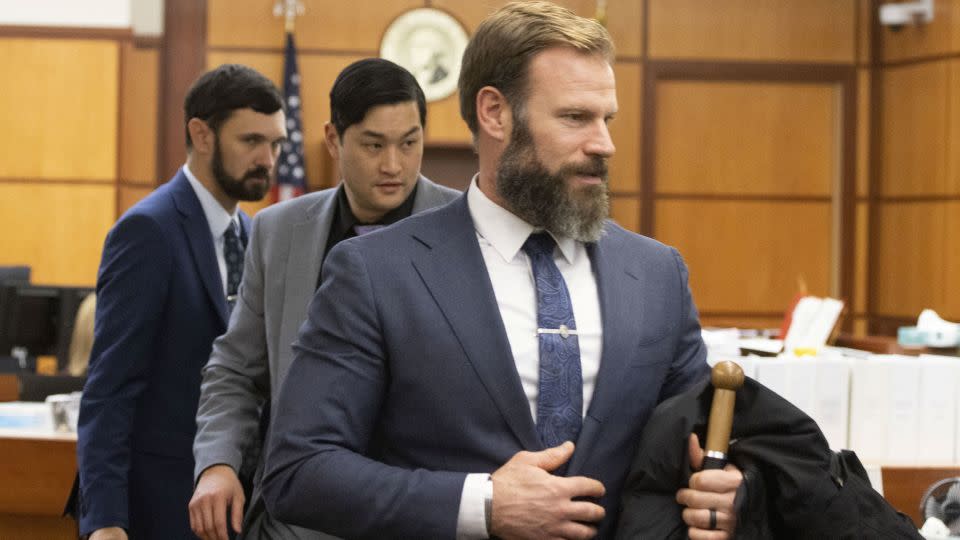 (From front to back) Matthew Collins, Timothy Rankine and Christopher Burbank head out of Pierce County Superior Court in Tacoma, Washington, on December 6, 2023. - Ellen M. Banner/Pool/Reuters