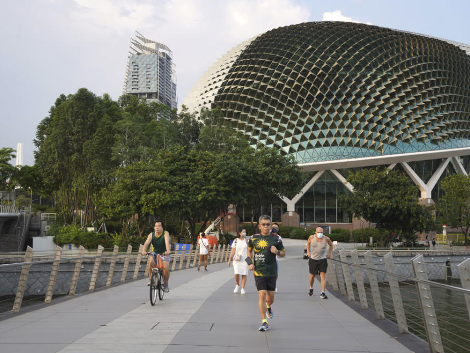 People exercise in the Marina Bay area of Singapore.