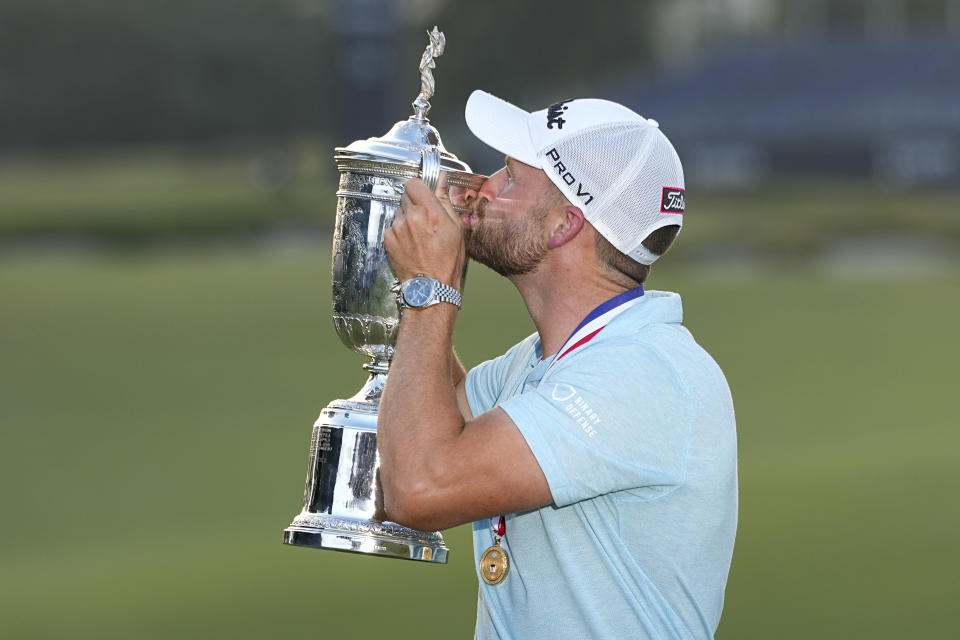 Wyndham Clark holds the trophy after winning after the U.S. Open golf tournament at Los Angeles Country Club on Sunday, June 18, 2023, in Los Angeles. (AP Photo/George Walker IV)