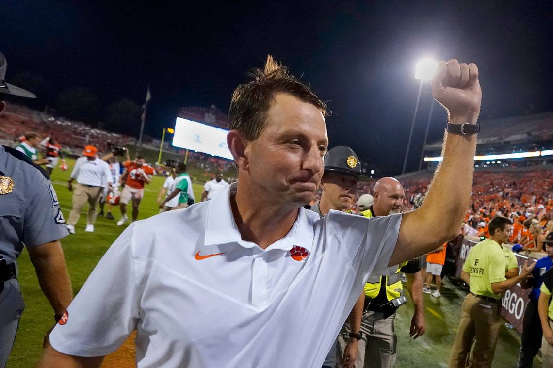 Clemson head coach Dabo Swinney pumps his fist to the crowd as he leaves the field after defeating Georgia Tech 14-8 in an NCAA college football game, Saturday, Sept. 18, 2021, in Clemson, S.C. (AP Photo/John Bazemore)