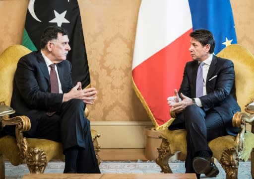 This photo handed out on January 11, 2020 by the Palazzo Chigi Press Office shows Italian Prime Minister Giuseppe Conte (R), who said Italy would make an "increased effort" to have a greater EU involvement in attempts at de-escalation in Libya