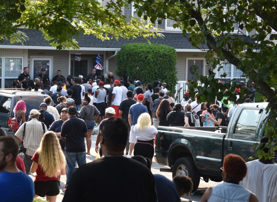 Protesters gather for an hourslong demonstration outside the Mount Laurel, N.J., home of bias-crimes suspect Edward Cagney Mathews.