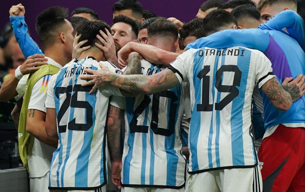 Lionel Messi of Argentina celebrates with teammates after scoring the team's second goal during the FIFA World Cup Qatar 2022 quarter final match between Netherlands and Argentina at Lusail Stadium on December 9, 2022 in Lusail City, Qatar