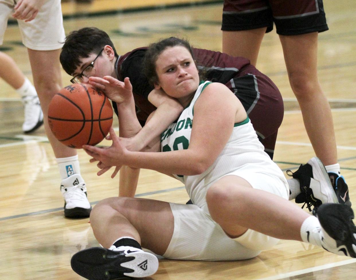 Brianna Heitkamp of Mendon gains possession of a loose ball in the second quarter of the Hornet win over Union City on Tuesday.